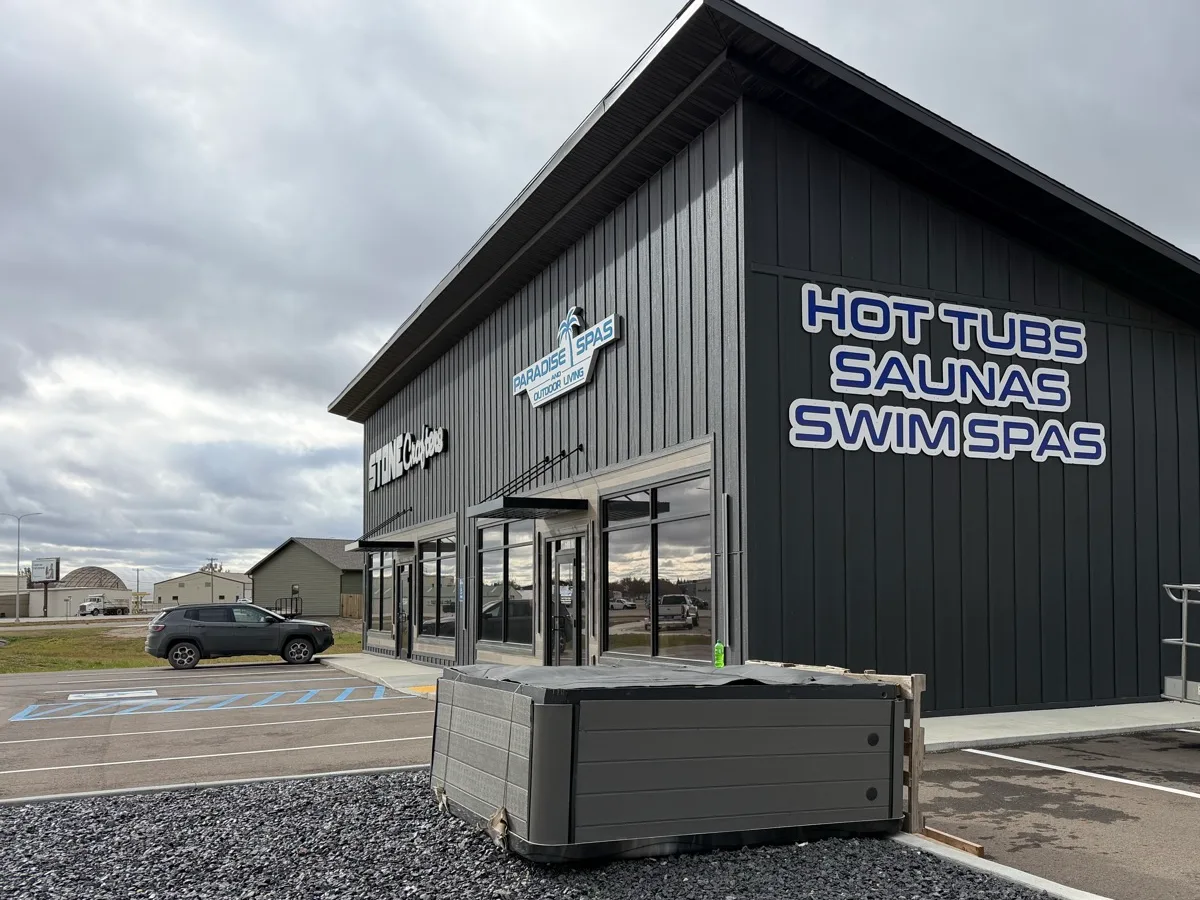 Hot Tubs, Saunas, Swim Spas sign on the side of the new Williston store