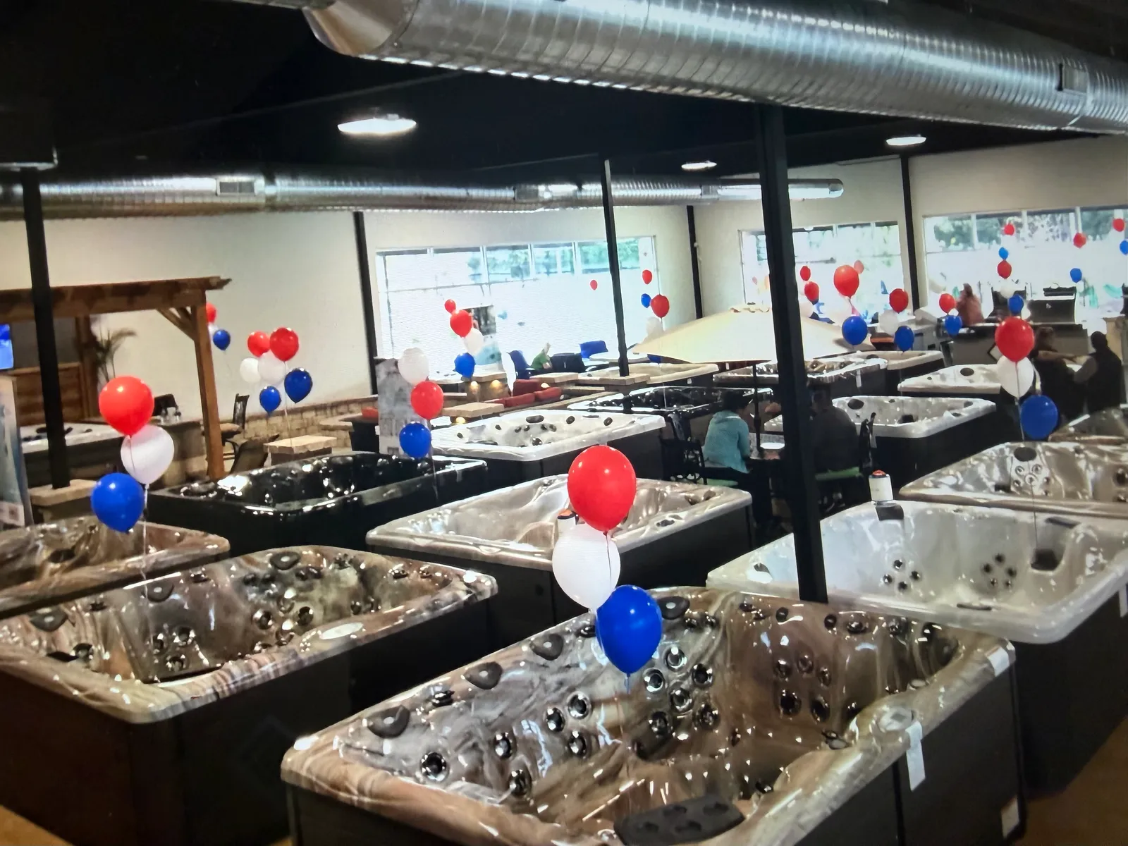 Grand opening balloons over the hot tubs in the Williston store